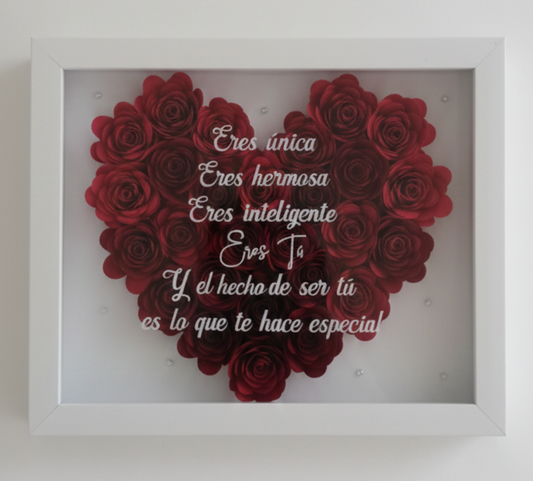 Marco decorativo con corazón de rosas rojas y mensaje inspirador.